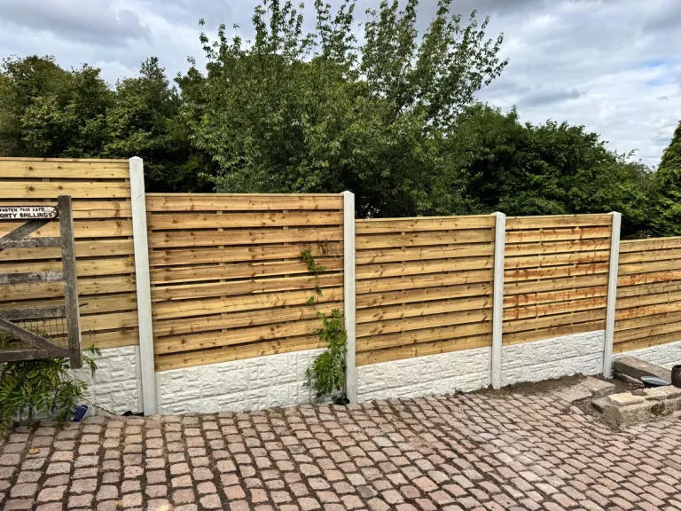 Horizontal Slatted Fencing for a Large Sloping Garden by Sheffield Fencing (photo 8)